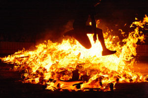 Jumping over the flames at a summer solstice celebration in Spain.