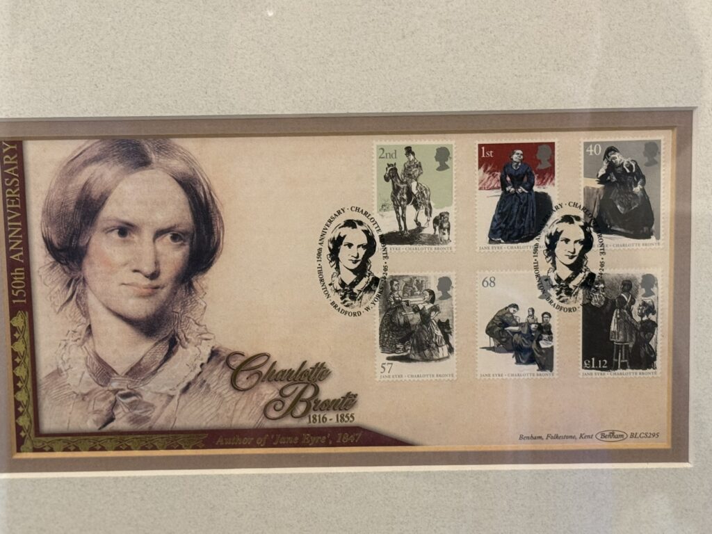 A reproduction of the famous 1850 portrait of Charlotte by George Richmond, and stamps in her honor.